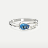 Sterling silver ring featuring an oval-cut gemstone in an open-band setting with a sleek, minimalist design.